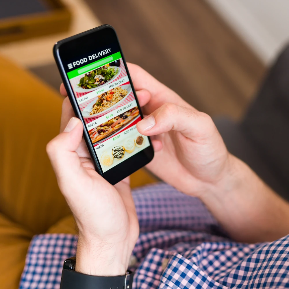 A customer ordering food for collection via a mobile app
