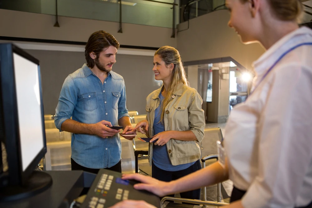 Couple interacting with each other at a check counter.