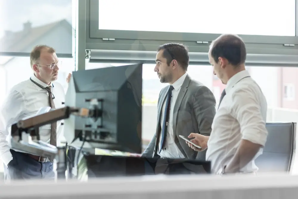 People working in an office with Eposbuddy's enterprise point of sale system.