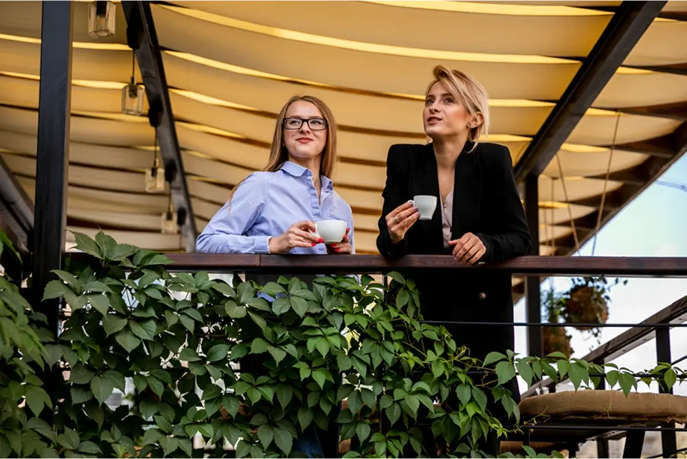 Low angle view of business women having a coffee break.