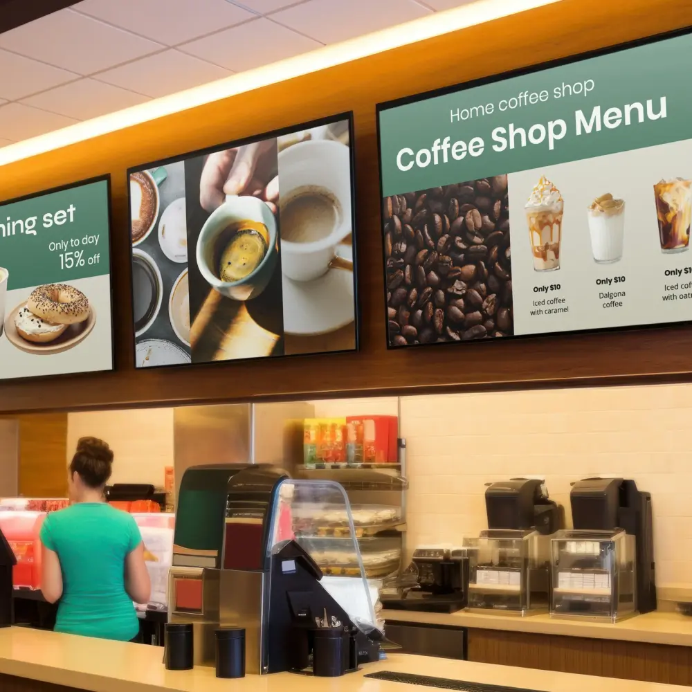 Overhead display screens showing coffee shop menu